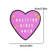 Pink heart shaped embroidery with the text POSITIVE VIBES ONLY and gold sparkles