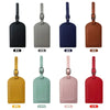 A collection of classic PU leather luggage tags in various colors including black, gray, navy blue, brown, yellow, mint green