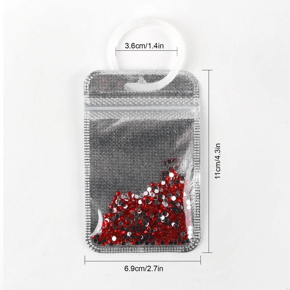 A clear plastic storage bag with a seal, filled with red and black glitter, shown next to a measurement ruler.