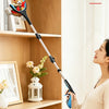 A pregnant woman holds a foldable grabber tool against a wooden shelf with various items.