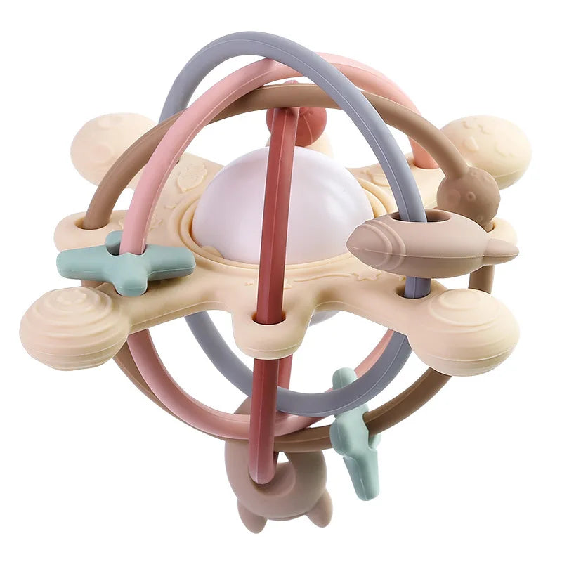 A silicone sensory rattle ball with various colored rings and components for baby development.