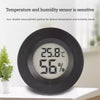 A black mini digital hygrometer thermometer displaying 25.8°C and 56% humidity.