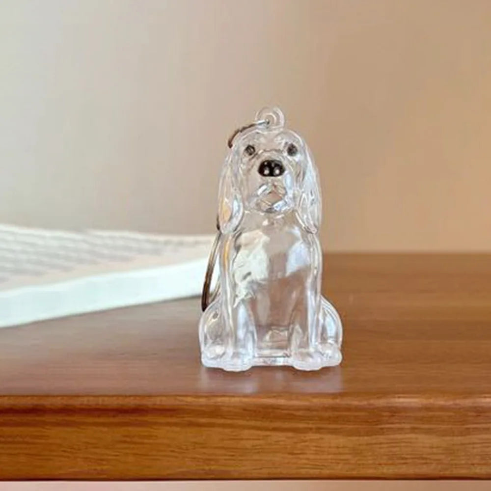 Clear glass pendant keychain shaped like a dog's head