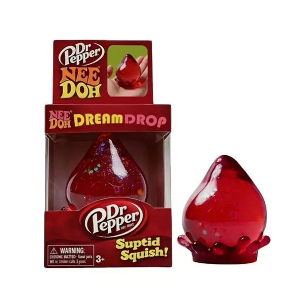 A box of Dr Pepper Nee Doh Dream Drop stress relief toy featuring a red, squishy cube.