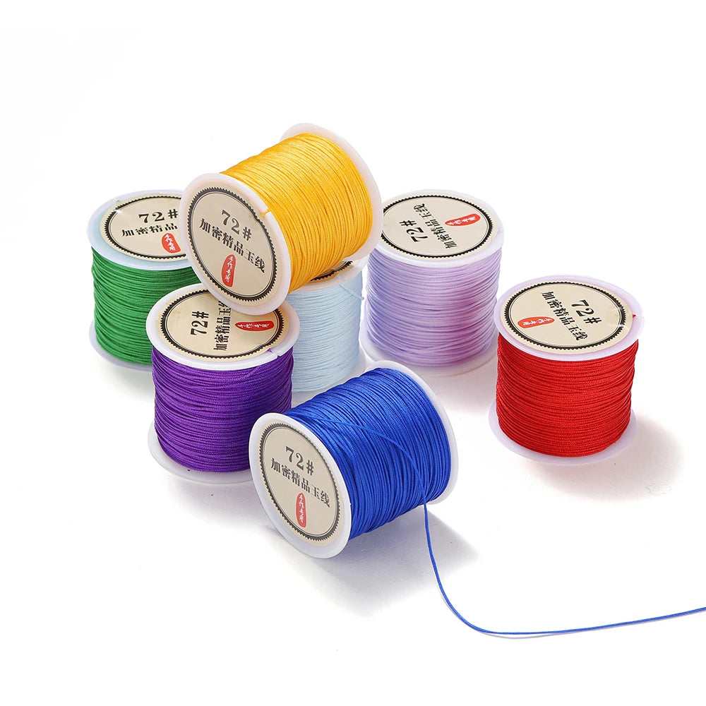 Rolls of 0.8mm nylon macramé cord in various colors including yellow, green, purple, blue, and red for jewelry making