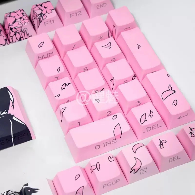 Pink Raven Sakura keycaps arranged on a white surface for a mechanical keyboard