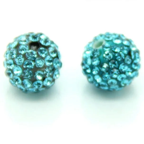A pair of round, teal blue crystal clay beads for DIY jewelry and craft projects.