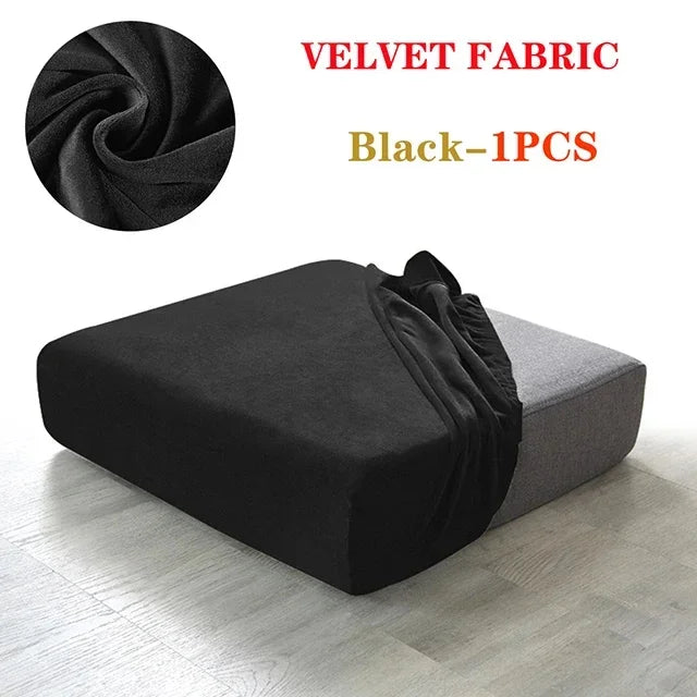 Black velvet fabric sofa cover shown draped on a gray sofa cushion.