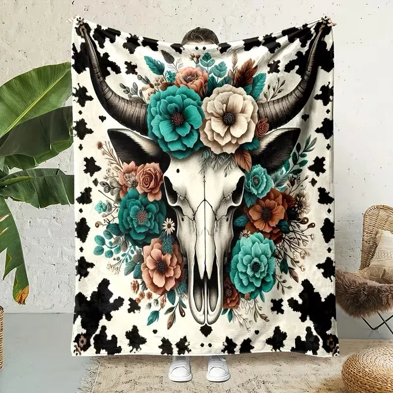A flannel blanket featuring a detailed illustration of a Highland cow head with floral and foliage designs.