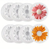 A set of silicone molds shaped like pink, white, and orange flowers for crafting candles, soap, and resin.