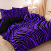A purple and black zebra print duvet cover set displayed on a bed.
