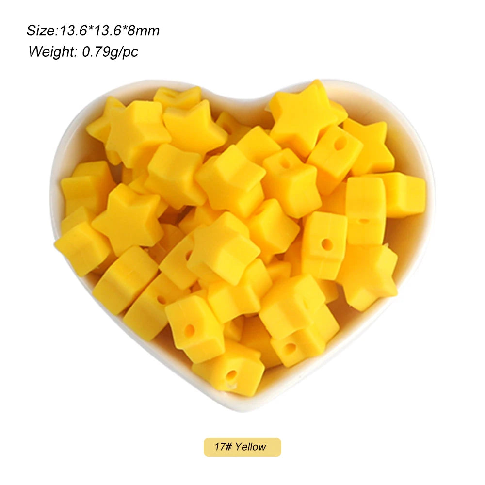 A pile of yellow silicone star heart beads for DIY jewelry making