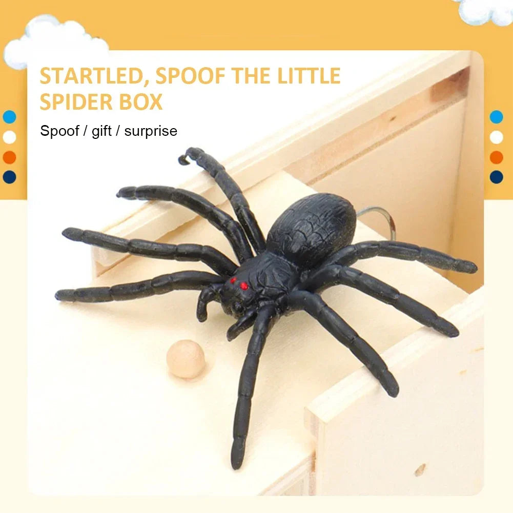 A black spider toy is shown emerging from a wooden box, used as a surprise gift or prank.