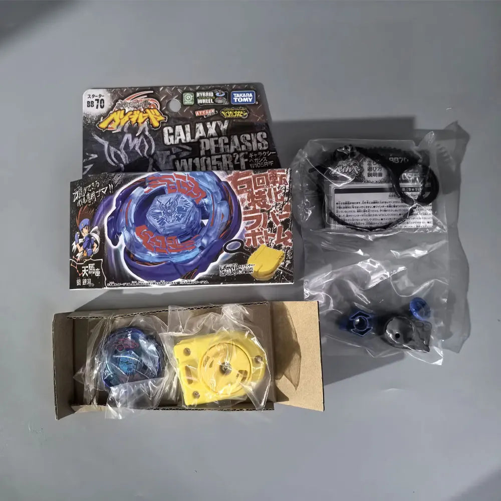 A set of metal spinning tops featuring a galaxy Pegasus design and various components in packaging.