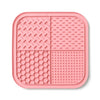 Pink silicone lick mat for dogs and cats with suction cups divided into four sections