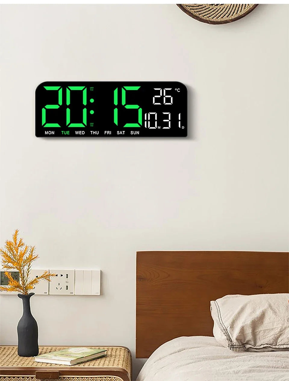 A large black LED digital wall clock displaying 20:15, 26 degrees Celsius, and the day of the week.