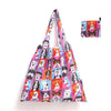 A colorful reusable shopping tote bag featuring various dog faces and portraits.