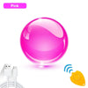 A pink LED flying spinner toy with a boomerang action is shown next to its charging cable and a wireless receiver.