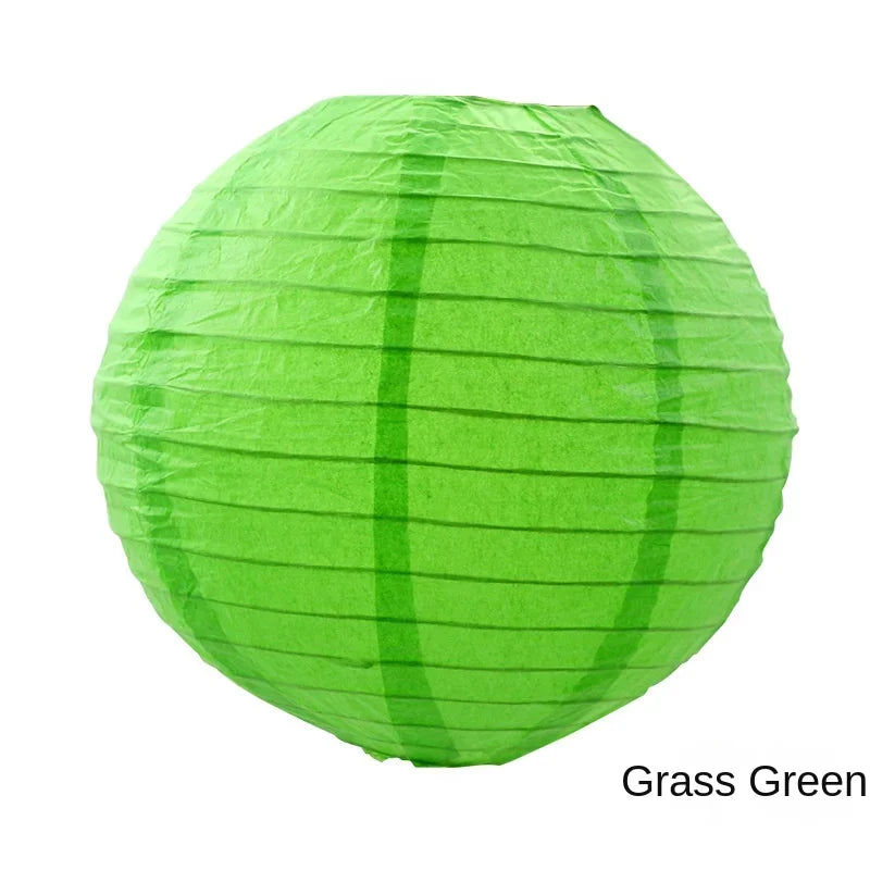 A round, lime green paper lantern made of crinkled green paper.