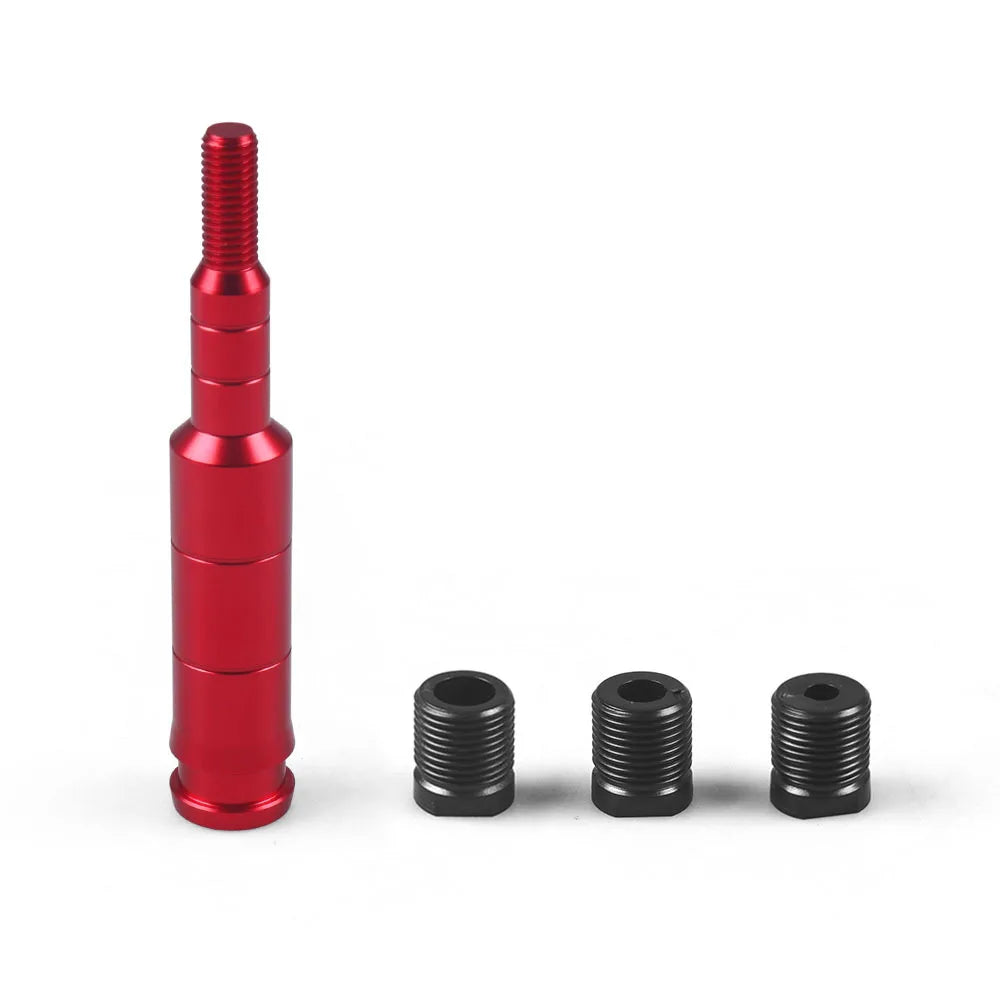 A red aluminum shift knob extender with threaded ends shown against a white background.