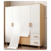 A light wood cabinet with white doors and drawers featuring matte black self-adhesive vinyl wallpaper.