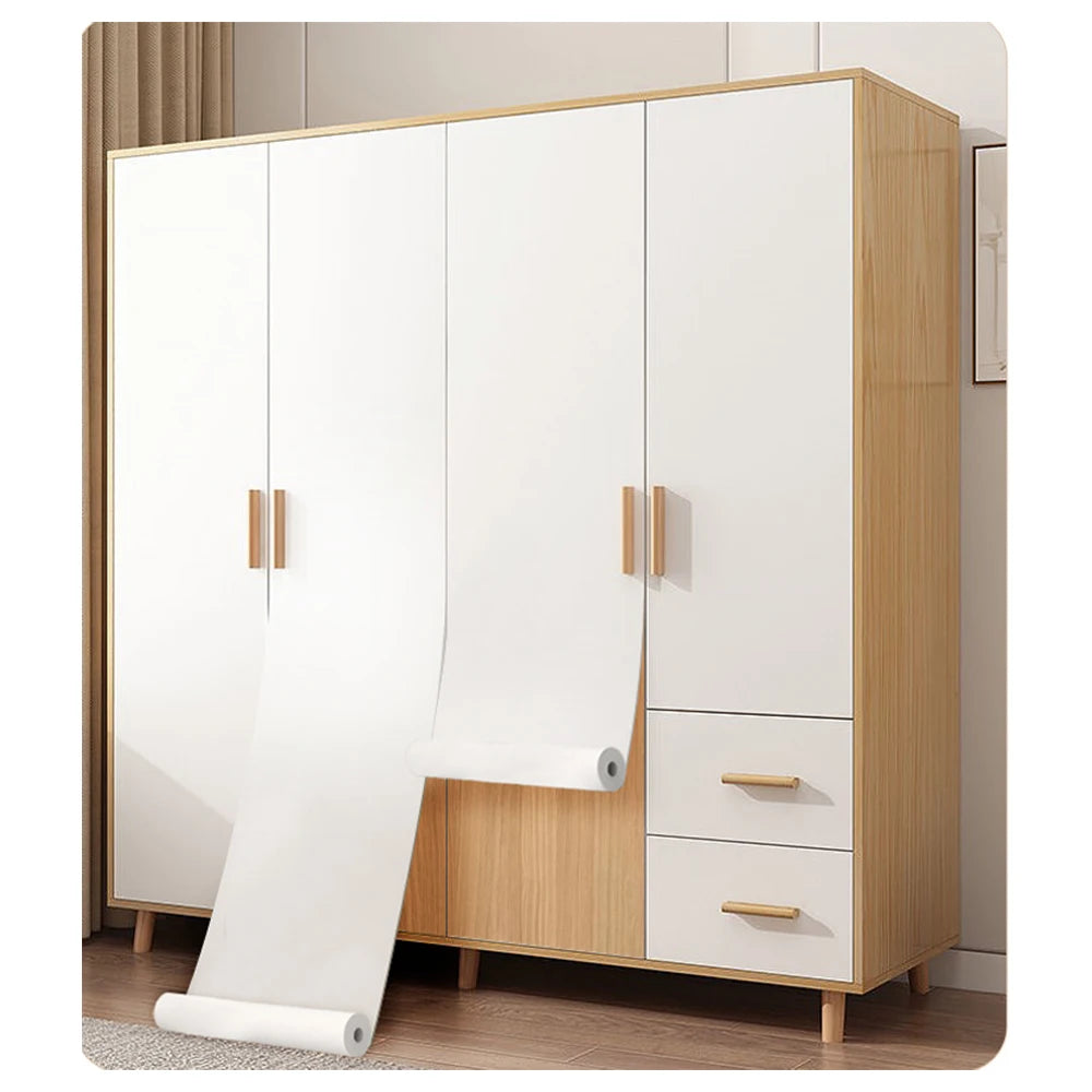 A tall cabinet with white doors and drawers featuring self-adhesive matte white vinyl wallpaper.