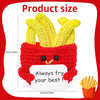 A yellow crochet pocket hug doll is shown resting on a red knitted fabric, next to a serving of french fries.
