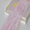 Pink glitter tassel string curtain for doorways and room dividers displayed next to its packaging.