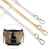 Silver and gold adjustable metal chains used as shoulder straps for bags
