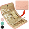 A pink foldable waterproof jewelry roll with a zippered interior displaying various gold and pearl necklaces and earrings.