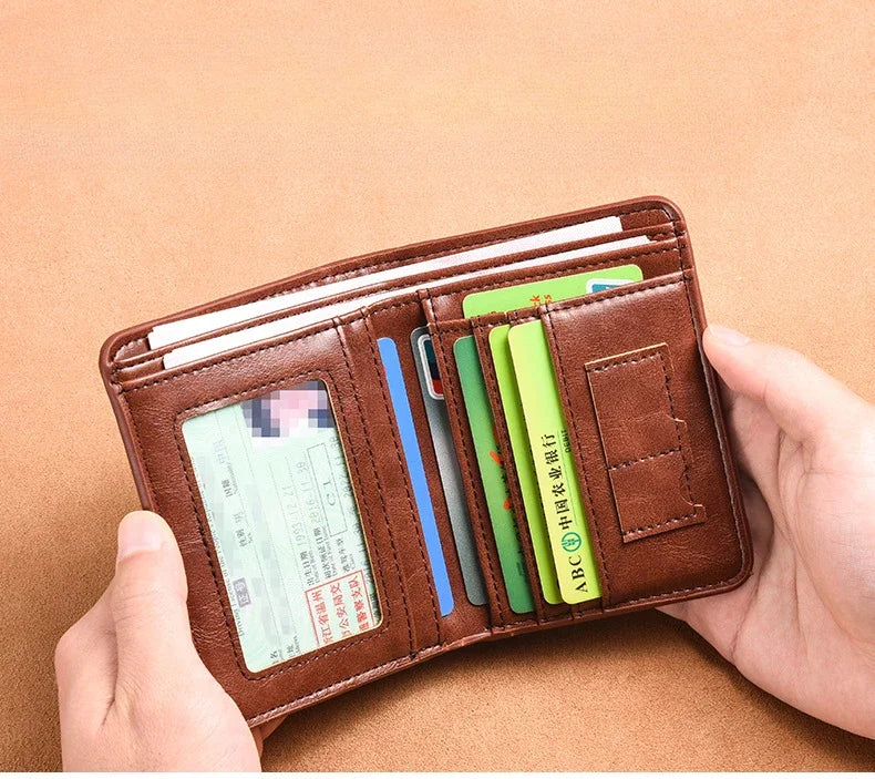 A hand holds a brown PU leather card holder wallet filled with various cards and a credit card.