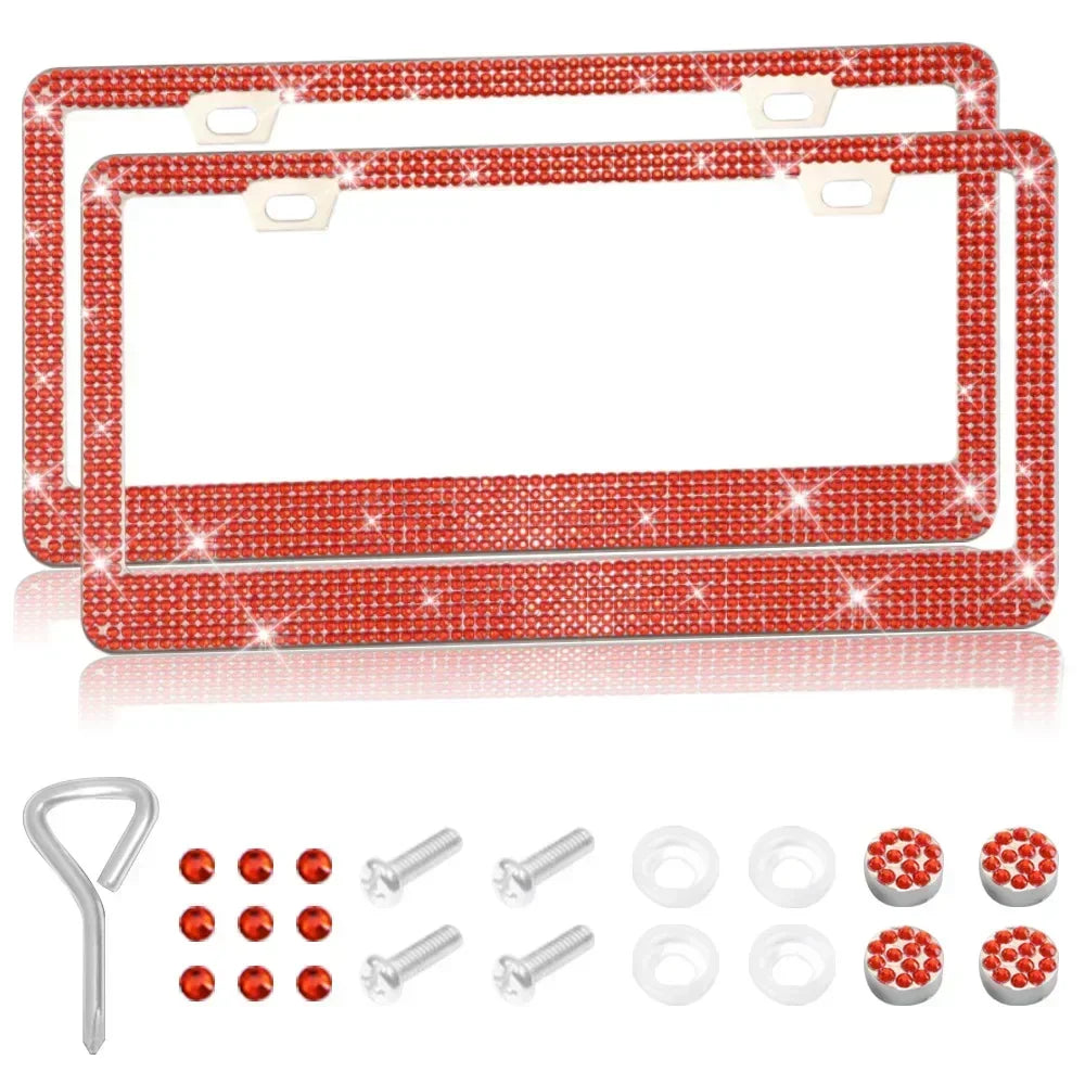 A pair of red crystal rhinestone license plate frames with screw caps and mounting hardware.