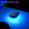 A compact blue LED light is mounted on a surface, illuminating the area with a bright glow.