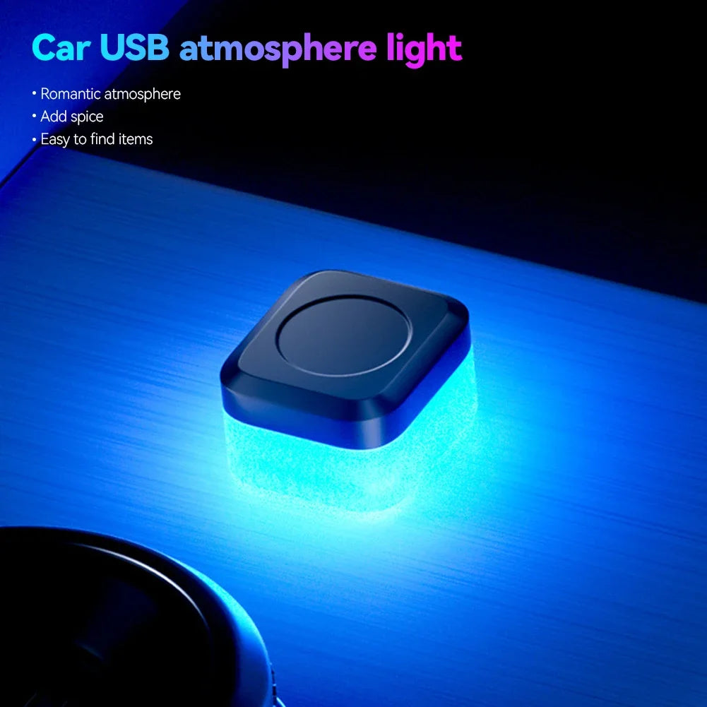 A compact blue LED light is mounted on a surface, illuminating the area with a bright glow.