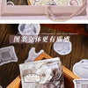 A collection of vintage alchemy washi stickers featuring decorative elements and metal-embossed designs for journaling.