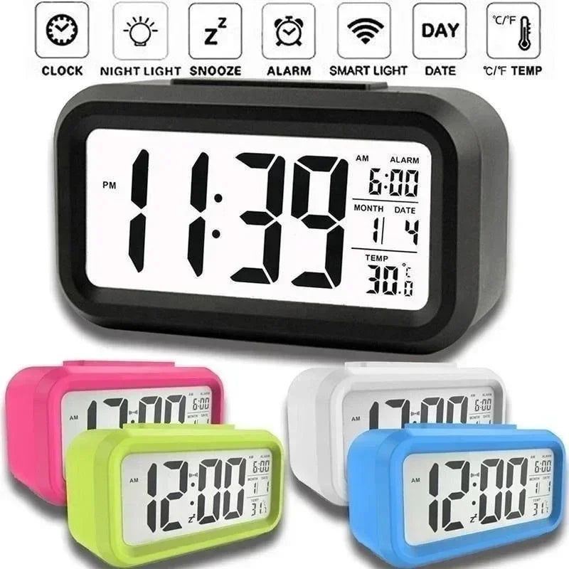 A collection of compact LED digital alarm clocks in pink, lime green, white, and blue.