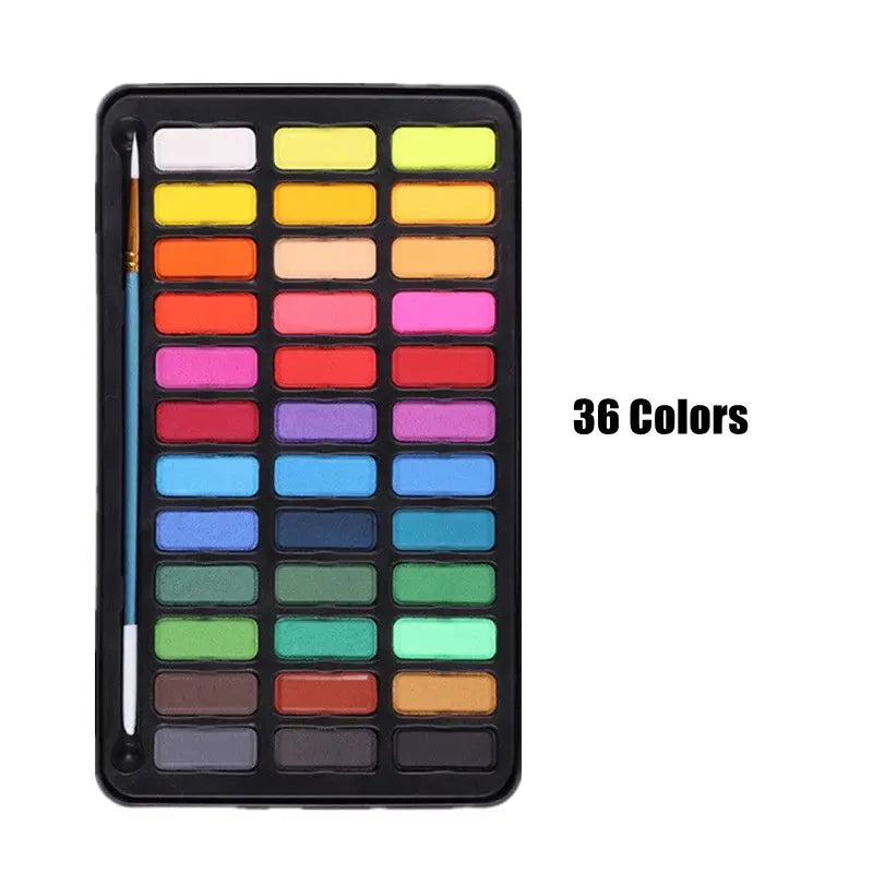 A black metal case containing 36 watercolor paint colors arranged in a grid.