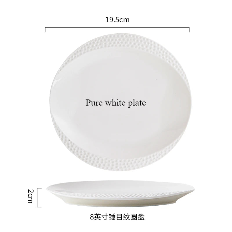 A pure white plate and a shallow white ceramic soup bowl are shown.