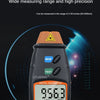 A black digital tachometer measuring 956.3 m/min RPM, used for non-contact measurement.