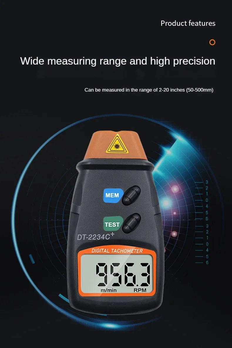 A black digital tachometer measuring 956.3 m/min RPM, used for non-contact measurement.