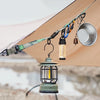 A close-up of a green strap and hanging ring attached to a canvas tent fabric.