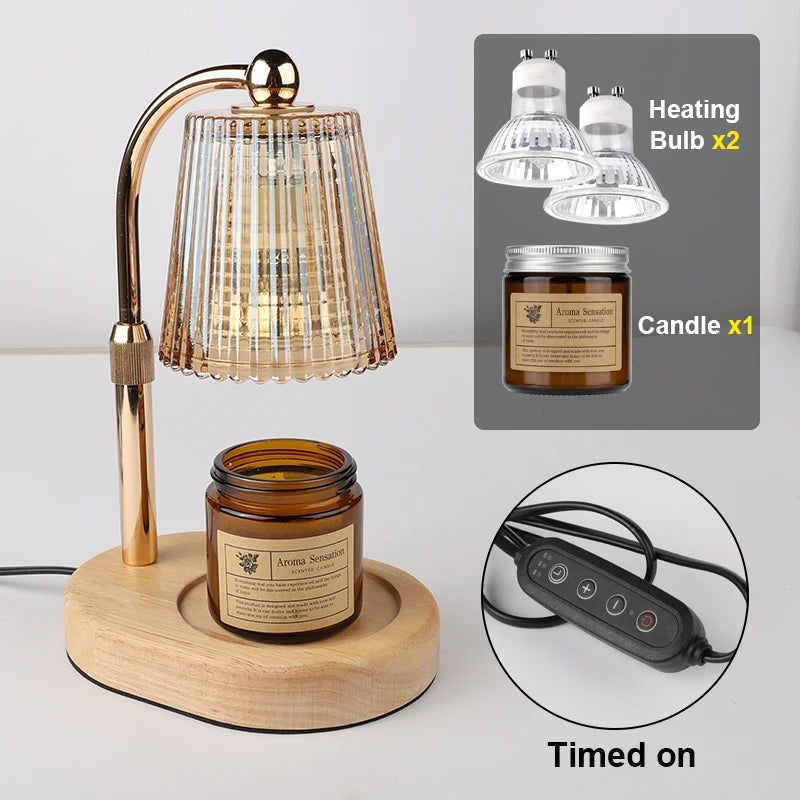 A brass lamp with a glass shade and a wooden base sits next to a jar of candle and two heating bulbs.
