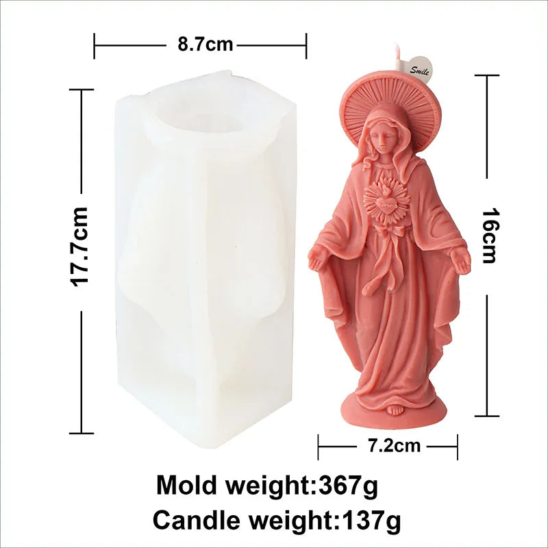 A pink silicone mold shaped like a religious figure for crafting candles and resin.