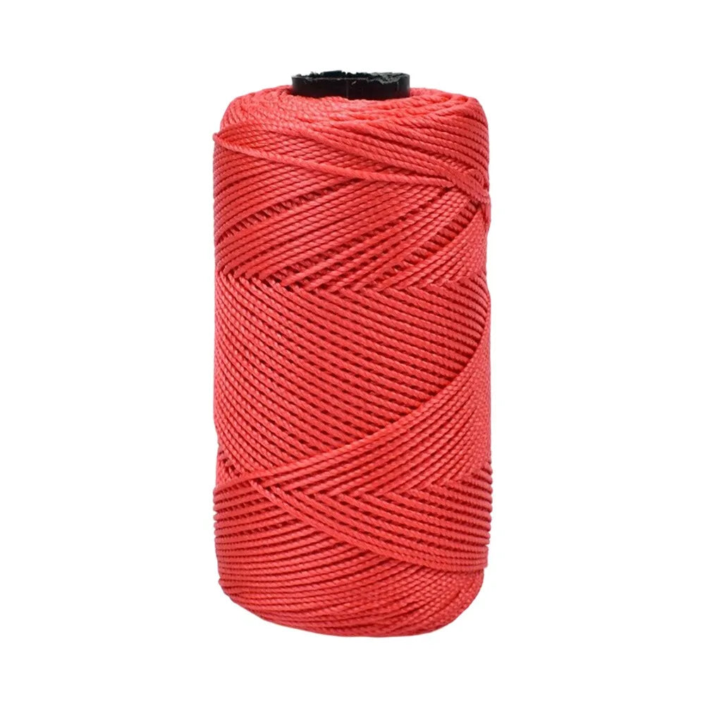 A spool of bright red ice cotton silk thread for knitting and crochet