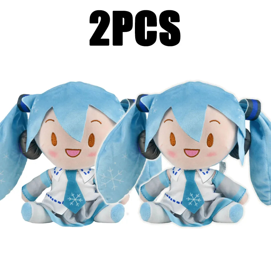 Two soft blue Hatsune Miku plush dolls with white accents and snowflake details