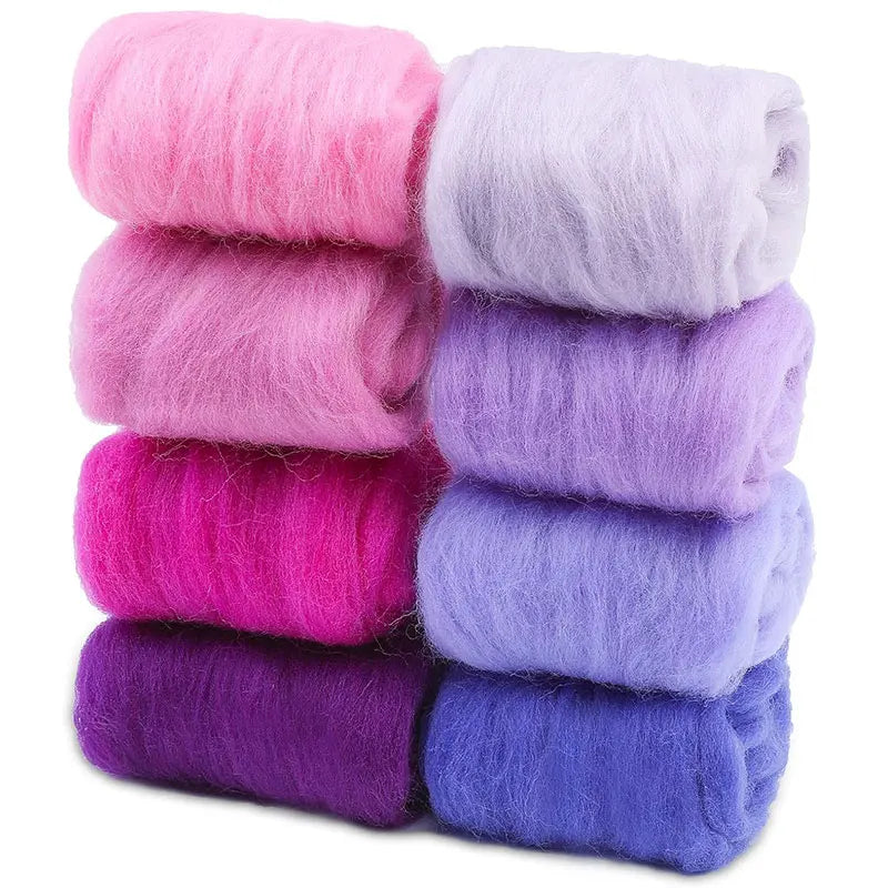 A stack of eight colored wool roving packs for needle felting, including pink, purple, and blue shades.