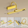 A gold-colored cordless rechargeable picture light assembly showing various installation and usage angles.
