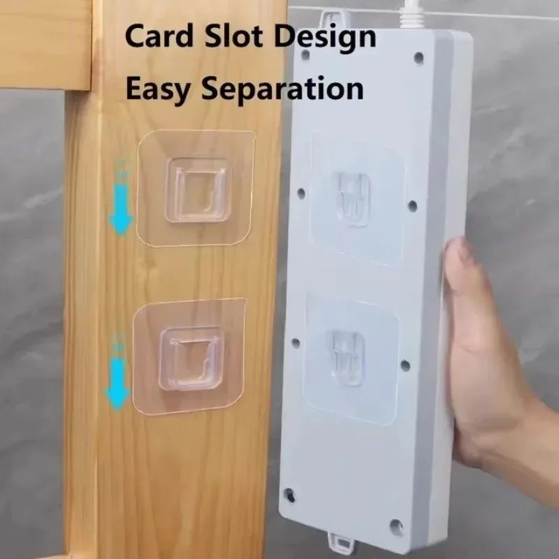Transparent wall hooks designed for easy separation, mounted on a wooden panel.