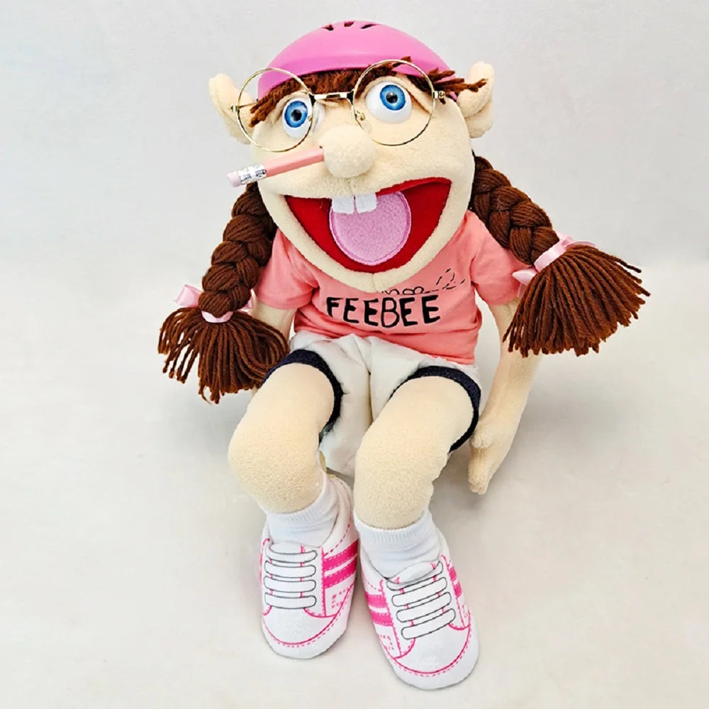 A plush toy of the character Feebee with brown hair, pink shirt, and glasses.