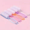 A set of nail art brushes with long, colorful handles and white bristles displayed on a pink background.